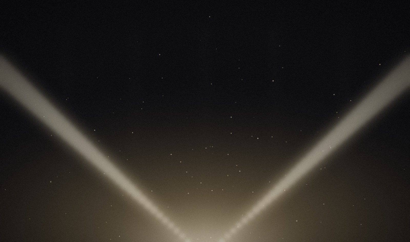 A V of light rising from darkness
